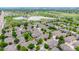 Aerial view of the neighborhood with a glimpse of a scenic lake at 3000 E 112Th Ave # 86, Northglenn, CO 80233