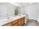 This bathroom features double sinks, large mirror, white cabinets, and a separate shower at 3000 E 112Th Ave # 86, Northglenn, CO 80233