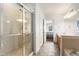 Spa-like bathroom featuring tiled shower, vanity with storage, and designer fixtures at 3000 E 112Th Ave # 86, Northglenn, CO 80233