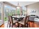 Bright dining room featuring a large table, hardwood floors, and lots of natural light at 3000 E 112Th Ave # 86, Northglenn, CO 80233
