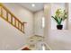 Welcoming entryway featuring decorative tile floors, staircase, and decorative niche at 3000 E 112Th Ave # 86, Northglenn, CO 80233