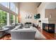 Cozy living room with fireplace, hardwood floors, soaring ceilings, and comfortable seating at 3000 E 112Th Ave # 86, Northglenn, CO 80233