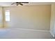 Spacious bedroom with neutral carpeting and a bright window, offering a serene and comfortable retreat at 4788 Laurelglen Ln, Highlands Ranch, CO 80130