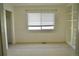 Bright bedroom with a built-in bookcase, neutral carpet, and a large window with blinds at 4788 Laurelglen Ln, Highlands Ranch, CO 80130