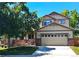Charming two-story home featuring a two-car garage, mature trees, and a well-maintained lawn at 4788 Laurelglen Ln, Highlands Ranch, CO 80130