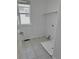 Bright laundry room featuring tile floors, built-in shelving, and a large window providing ample natural light at 4788 Laurelglen Ln, Highlands Ranch, CO 80130