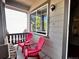 Charming patio featuring two bright red Adirondack chairs and scenic views at 4788 Laurelglen Ln, Highlands Ranch, CO 80130