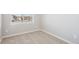 Bedroom with neutral walls, carpet, and a large window overlooking the neighborhood at 17942 E 94Th Pl, Commerce City, CO 80022