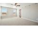 Bright bedroom with carpet, ceiling fan, two windows letting in natural light, and neutral walls at 17942 E 94Th Pl, Commerce City, CO 80022