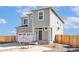 Charming two-story home with gray siding, a two-car garage, and a well-manicured front yard at 17942 E 94Th Pl, Commerce City, CO 80022