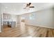 Open-concept living room featuring hardwood floors, recessed lighting, and sliding doors to backyard at 17942 E 94Th Pl, Commerce City, CO 80022