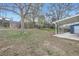 Large, grassy backyard shows a covered patio and wooden fence at 9921 Wigham St, Thornton, CO 80229