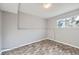 Neutral bedroom with wood floors and a window at 9921 Wigham St, Thornton, CO 80229