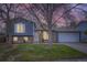 Charming split level home with a brick and blue siding, complemented by a well-manicured lawn at 9921 Wigham St, Thornton, CO 80229