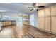 Eat-in kitchen with wood cabinets, stainless steel appliances, and sliding door to the backyard at 9921 Wigham St, Thornton, CO 80229