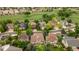 An aerial view shows the property among a community that is situated on a golf course at 7053 S Shawnee St, Aurora, CO 80016