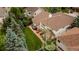 Aerial view of a beautiful backyard with patio, hot tub, and mature trees at 7053 S Shawnee St, Aurora, CO 80016