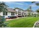 Beautiful backyard with lush green grass, mature trees, and a patio perfect for entertaining at 7053 S Shawnee St, Aurora, CO 80016