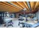 Spacious unfinished basement with exposed ceiling beams perfect for storage or creating a gym at 7053 S Shawnee St, Aurora, CO 80016