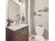Charming powder room with a marble countertop vanity and modern fixtures at 7053 S Shawnee St, Aurora, CO 80016