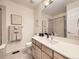 Bright bathroom with a glass-enclosed shower and stylish vanity with modern fixtures at 7053 S Shawnee St, Aurora, CO 80016