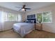 Inviting bedroom with large windows, plush carpet, and blue accents at 7053 S Shawnee St, Aurora, CO 80016