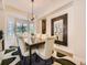 Elegant dining room featuring a modern chandelier, large mirror, and comfortable seating at 7053 S Shawnee St, Aurora, CO 80016