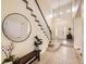 Inviting foyer with a staircase, high ceilings, and stylish decor at 7053 S Shawnee St, Aurora, CO 80016