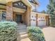 Inviting front entrance with brick columns and a well-manicured landscape at 7053 S Shawnee St, Aurora, CO 80016