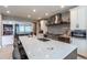 Spacious kitchen with center island, stainless-steel appliances and ample counterspace at 7053 S Shawnee St, Aurora, CO 80016
