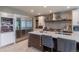 Modern kitchen featuring an island with marble countertops and stainless-steel appliances at 7053 S Shawnee St, Aurora, CO 80016