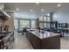 Bright, open kitchen design with granite countertops, a large island, and stainless steel appliances at 7053 S Shawnee St, Aurora, CO 80016