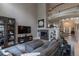 Spacious living room with fireplace, large screen television, and comfortable seating, perfect for relaxing and entertaining at 7053 S Shawnee St, Aurora, CO 80016