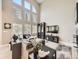 Bright living room showcasing large windows, a comfortable sectional sofa, and modern decor at 7053 S Shawnee St, Aurora, CO 80016