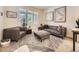 Cozy living room with modern furniture and a stylish geometric rug at 7053 S Shawnee St, Aurora, CO 80016
