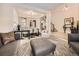Open-concept living area with elegant furnishings and seamless transition to the dining space at 7053 S Shawnee St, Aurora, CO 80016