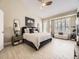 Comfortable main bedroom featuring neutral decor, large windows, and ample natural light at 7053 S Shawnee St, Aurora, CO 80016