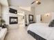Serene main bedroom boasting a fireplace, television, and bright, airy feel at 7053 S Shawnee St, Aurora, CO 80016