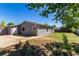 This backyard has a patio and a grassy lawn at 205 Spruce Ave, Lochbuie, CO 80603