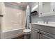 This bathroom has a combination tub and shower and a modern vanity at 205 Spruce Ave, Lochbuie, CO 80603