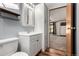 This bathroom has a modern vanity and additional storage space at 205 Spruce Ave, Lochbuie, CO 80603