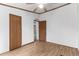 This spacious bedroom has two entryways and a ceiling fan at 205 Spruce Ave, Lochbuie, CO 80603