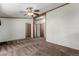 Spacious living room with carpeting, doors to various rooms and plenty of natural light at 205 Spruce Ave, Lochbuie, CO 80603