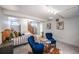 Finished basement bedroom with carpet, blue chairs, a staircase, and furnishings at 460 S Sherman St, Denver, CO 80209