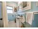 Charming bathroom with white vanity, hexagon tile floor, and vintage mirrored cabinet at 460 S Sherman St, Denver, CO 80209