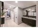 Hallway bathroom with double sink vanity and access to shower and bedroom at 460 S Sherman St, Denver, CO 80209