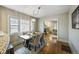 Open dining room with hardwood floors and views of the living room at 460 S Sherman St, Denver, CO 80209