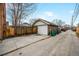 Detached brick two car garage with alley access, fenced yard and trash receptacles at 460 S Sherman St, Denver, CO 80209