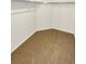 Large walk-in closet with wall-to-wall shelving and carpet flooring at 810 N Vandriver Way, Aurora, CO 80018