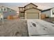 Two-story house with attached garage and landscaped front yard at 810 N Vandriver Way, Aurora, CO 80018